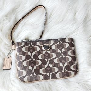 Womans brown retro COACH wristlet